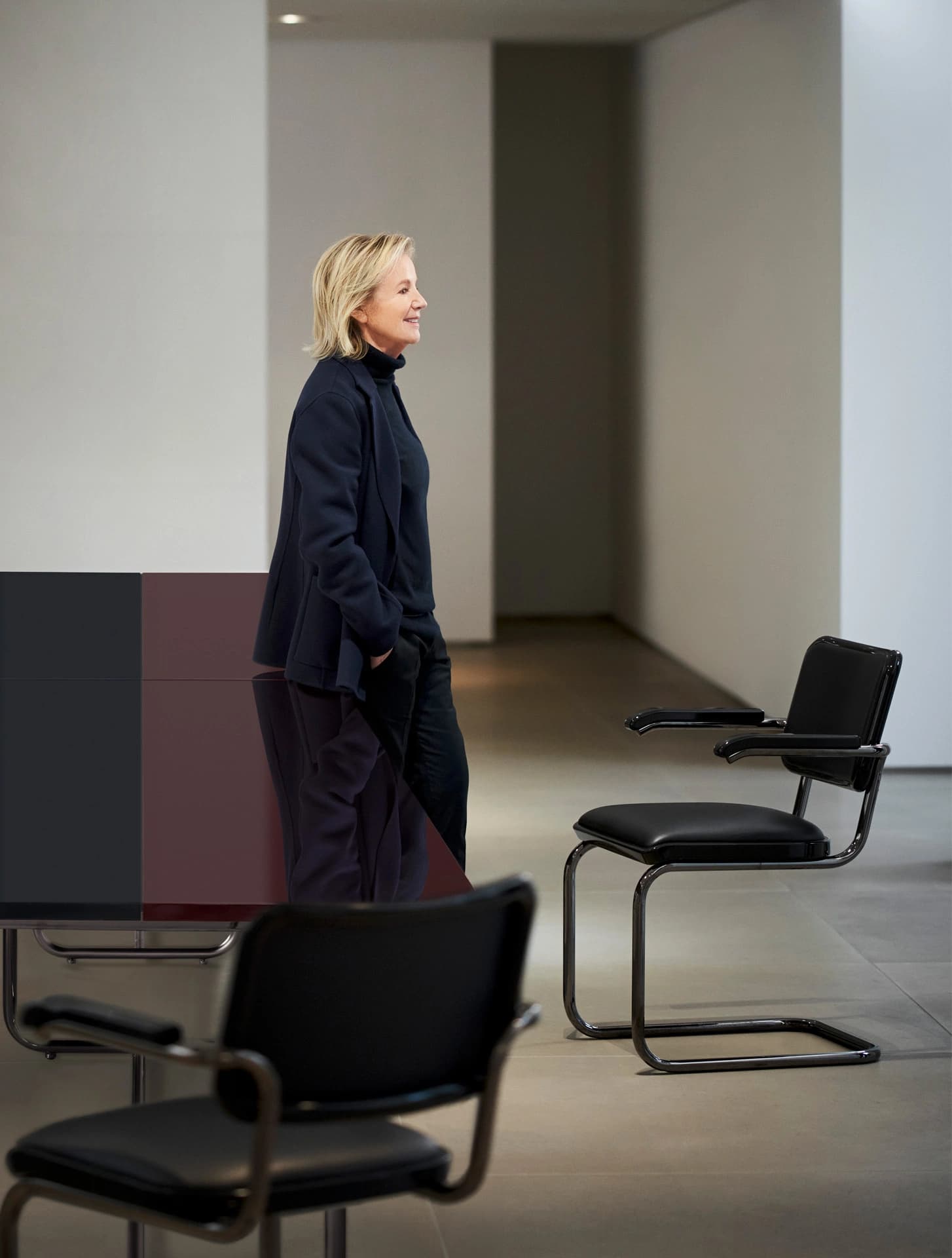 Editorial image for JS . THONET: S 64 SERIOUS 01 cantilever chair with leather upholstery in a minimalist interior.