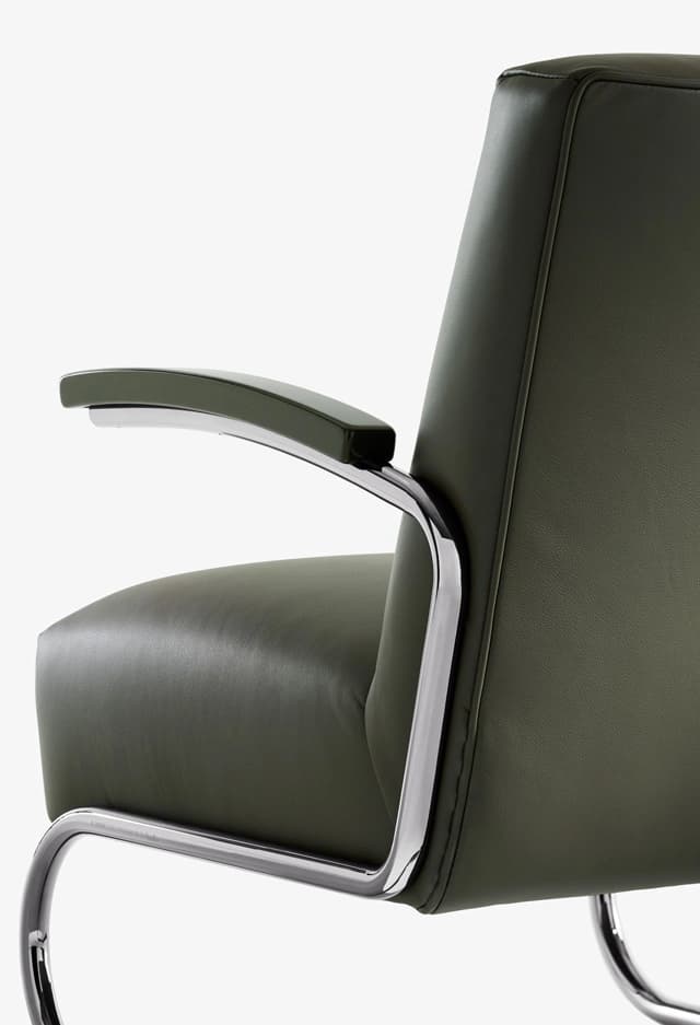 Detail shot for JS . THONET: S 411 DINING armchair with tubular steel frame and curved armrest.