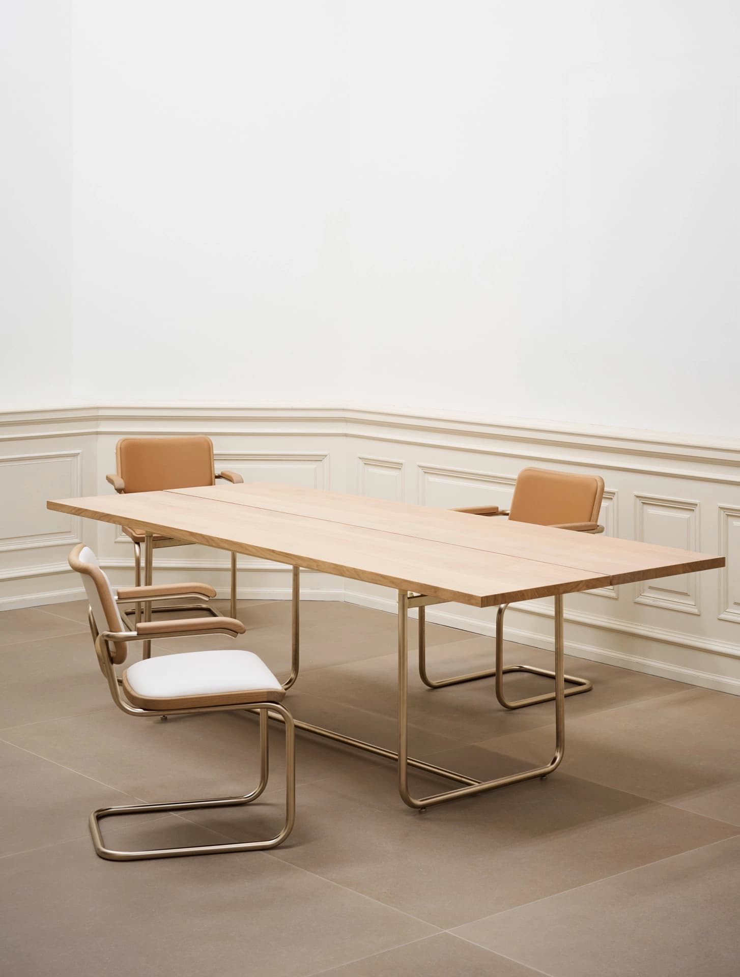 Editorial image for JS . THONET: light wood dining table with S 64 Nordic Edition cantilever chairs in a minimalist room.