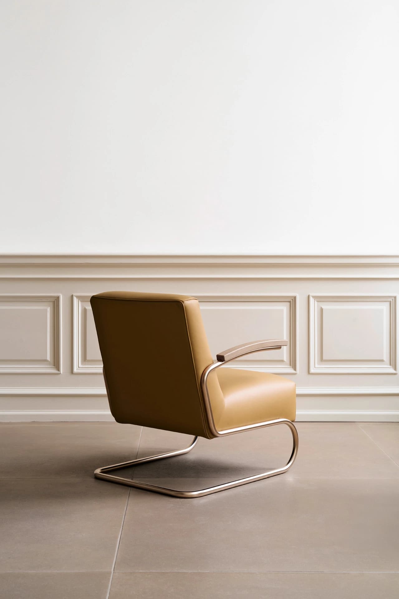 Editorial image for JS . THONET: S 411 cantilever lounge chair with leather upholstery in a minimalist room.