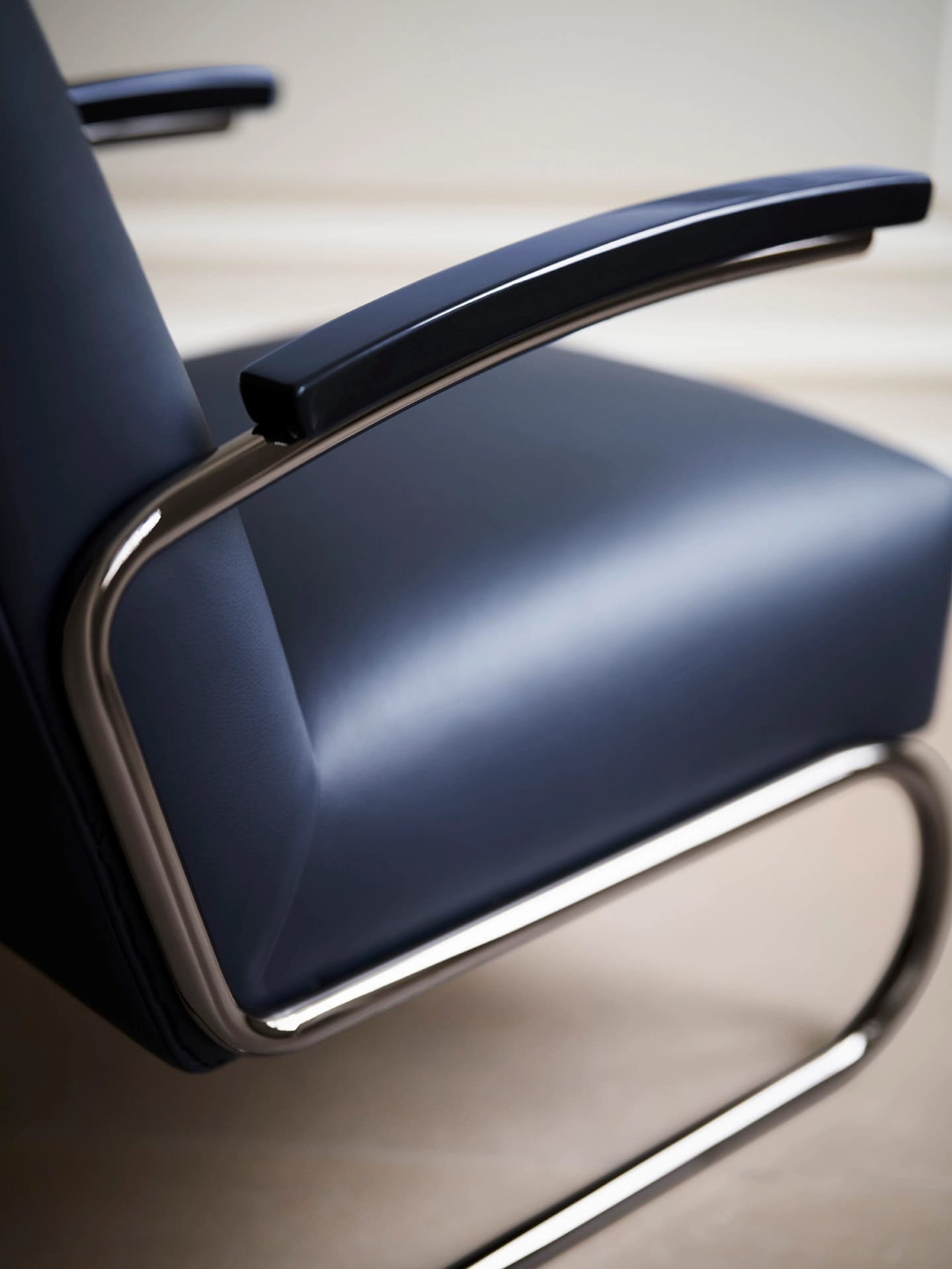 Detail shot for JS . THONET: S 64 SERIOUS cantilever chair with leather upholstery and glossy titanium frame.
