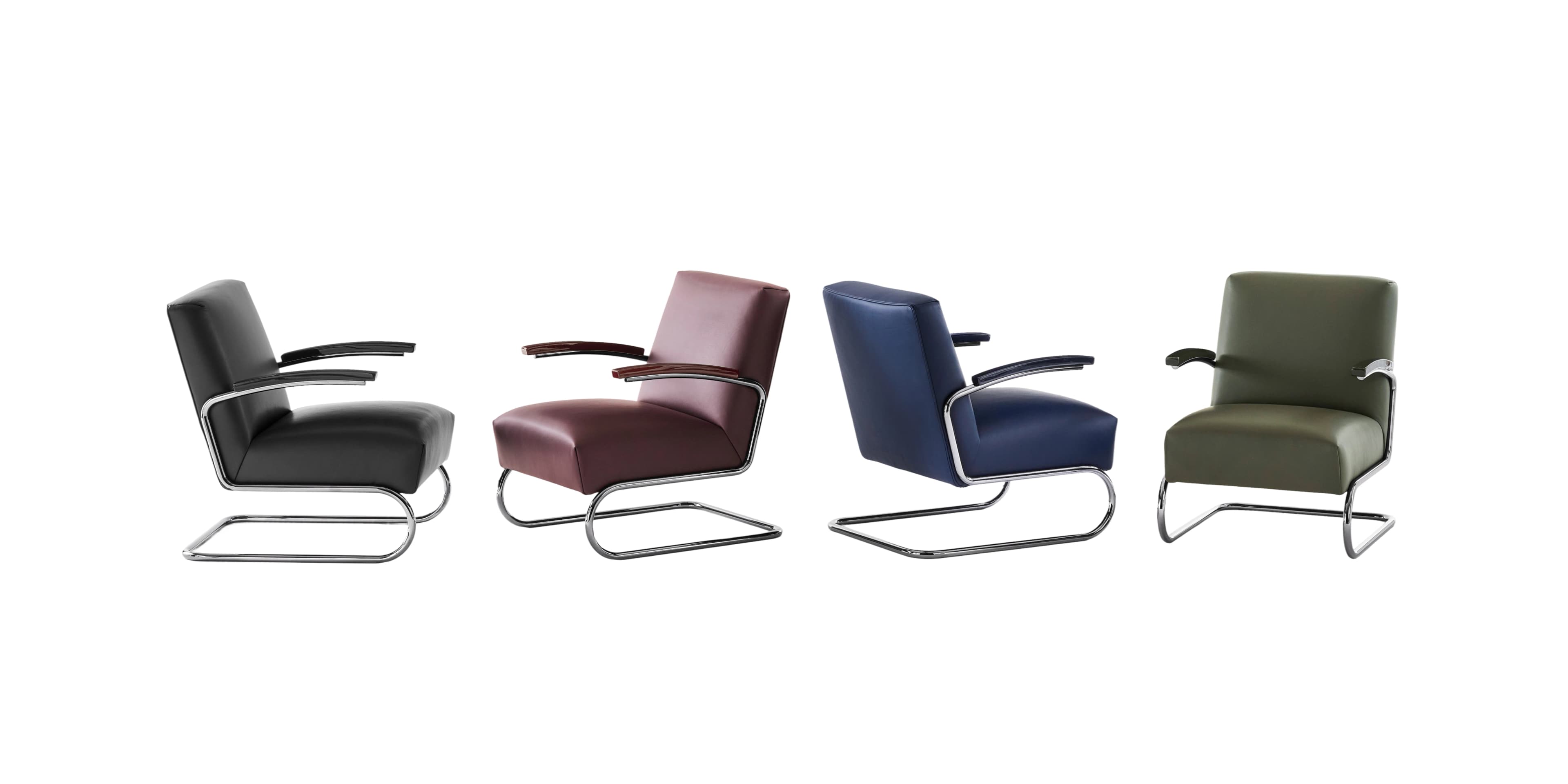 Thonet S 411 SERIOUS lounge chairs in various colors – black, bordeaux, dark blue and olive green – with padded seat and back and chrome-plated tubular steel frame, on a white background.